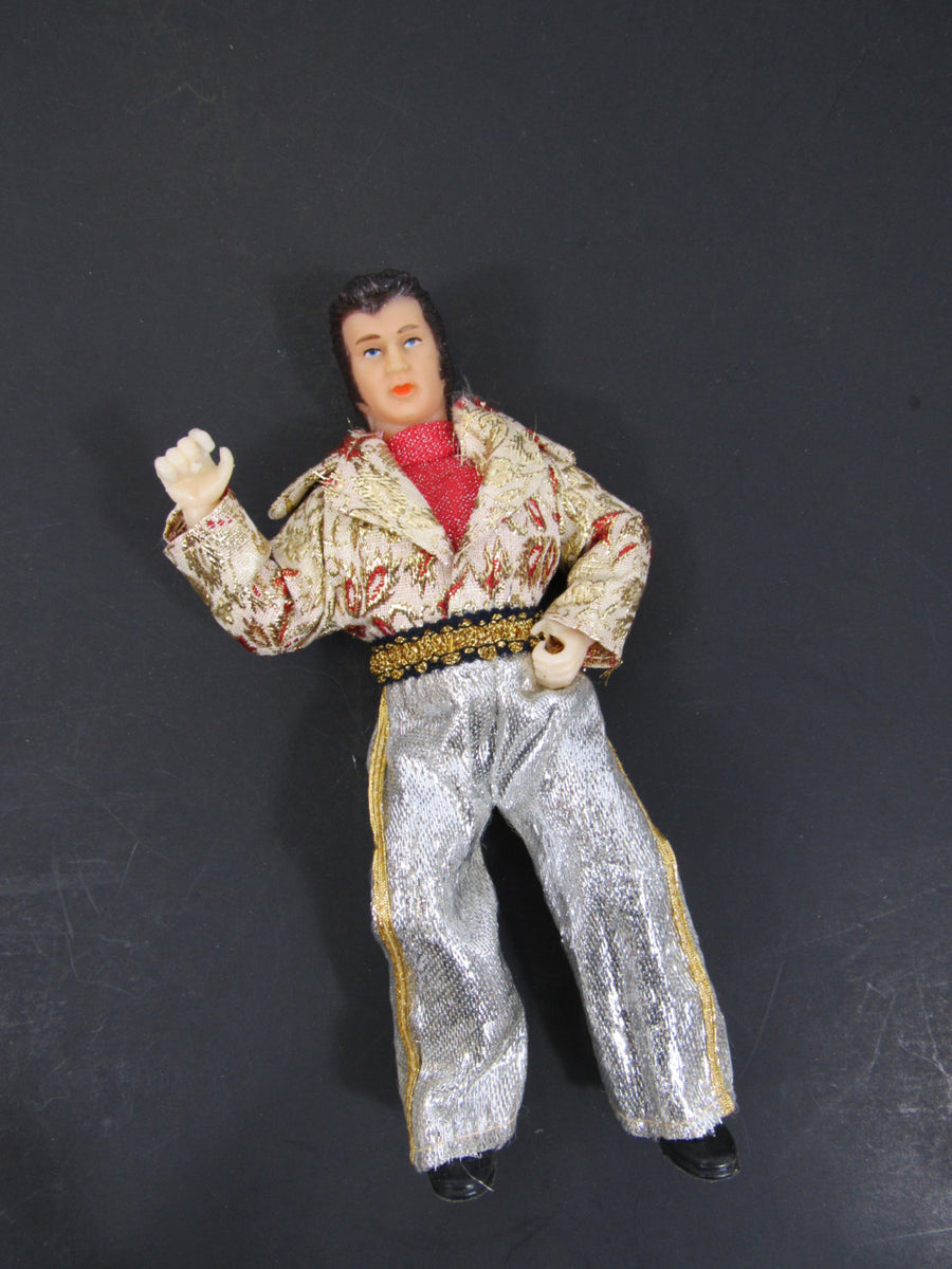 Elvis Presley shops Doll