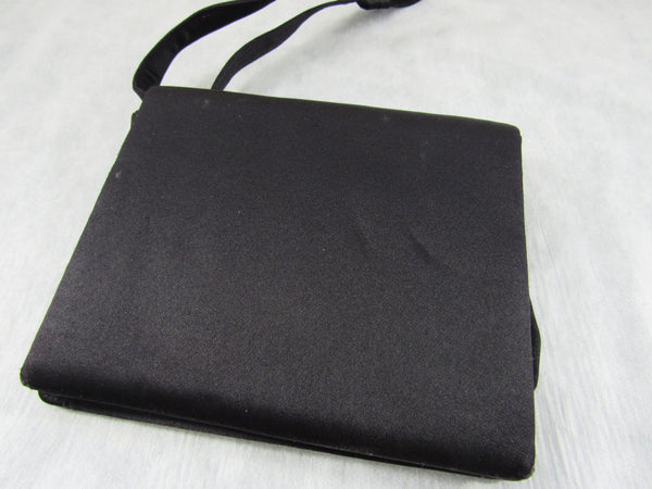 Black evening bag with shoulder strap